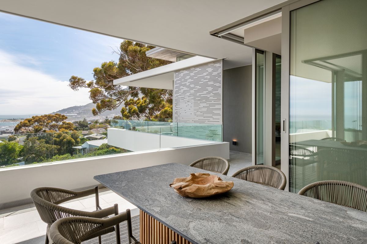 Prima Vista Penthouse terrace dining table with ocean view at Riva One