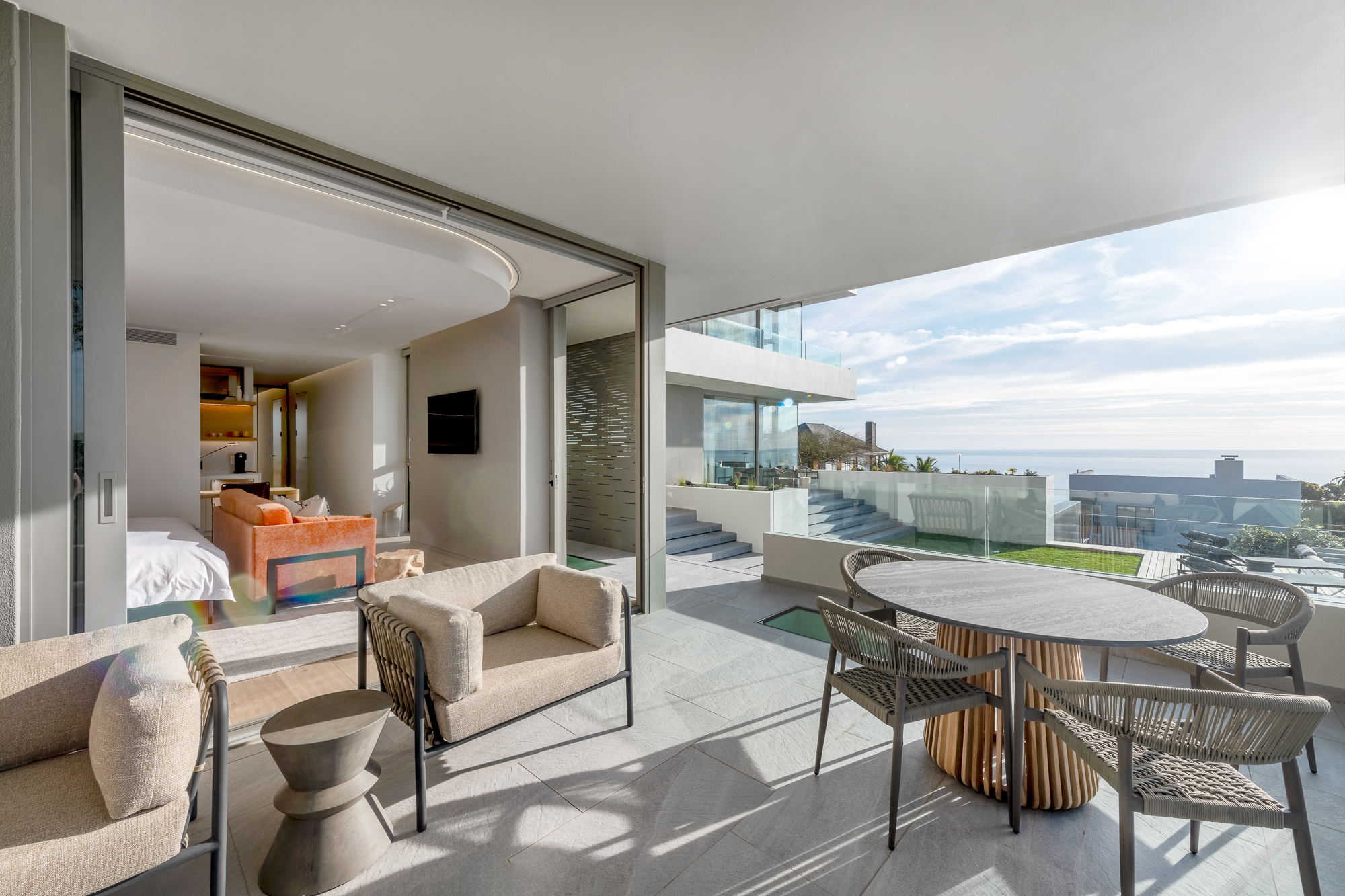 Private balcony terrace with ocean and mountain views, Sole Suite – Riva One, Camps Bay